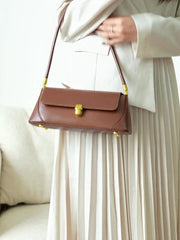 European Retro Shoulder Bag in brown leather, featuring a flap and adjustable strap, perfect for casual and elegant looks.