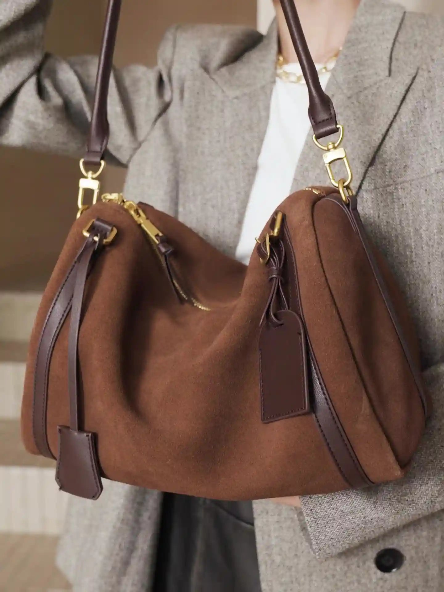 Suede Crescent Shoulder Bag in brown with leather trims and gold hardware, ideal for everyday use and casual outings.