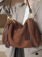Suede Crescent Shoulder Bag in brown with leather trims and gold hardware, ideal for everyday use and casual outings.