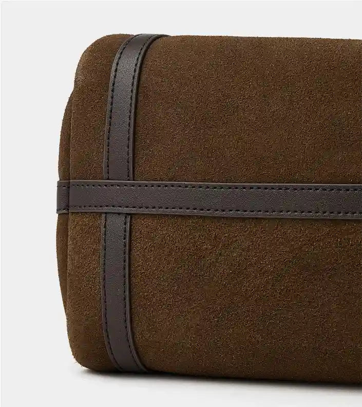 Close-up of the suede texture on the Suede Crescent Shoulder Bag showcasing leather trims.