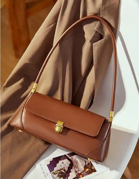 European Retro Shoulder Bag in brown leather with a sleek design, featuring a flap and adjustable strap.