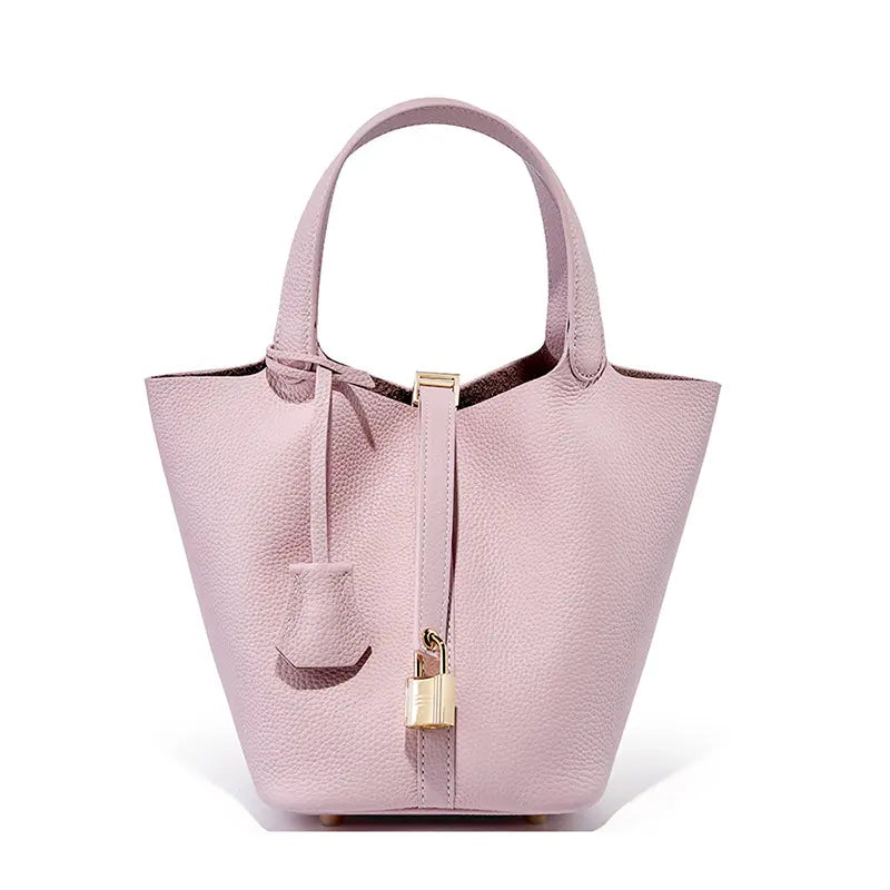 Classic Leather Bucket Bag in soft pink with minimalist design, top-handle, and chic drawstring closure.