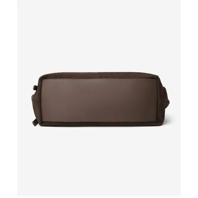 Suede Leather Pillow Hobo Bag featuring a sleek, minimalist design with a compact shape and durable suede and leather materials.