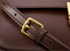 Minimalist Tofu Bag detail showing the adjustable strap and gold buckle on premium leather.