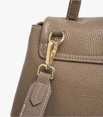Close-up of Premium Leather Crossbody Bag strap with gold hardware, showcasing its durable design and soft texture.