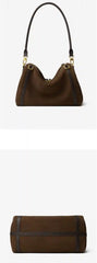 Suede Crescent Shoulder Bag showcasing a vintage-inspired silhouette with leather trims and adjustable strap.