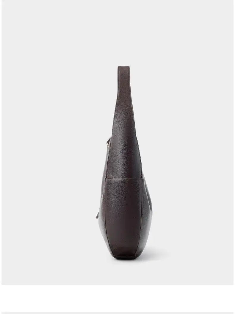 Leather Crescent Hobo Bag side view showcasing its sleek design and genuine leather material.