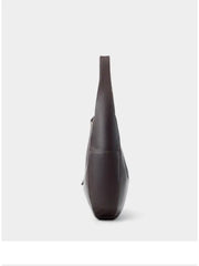 Leather Crescent Hobo Bag side view showcasing its sleek design and genuine leather material.