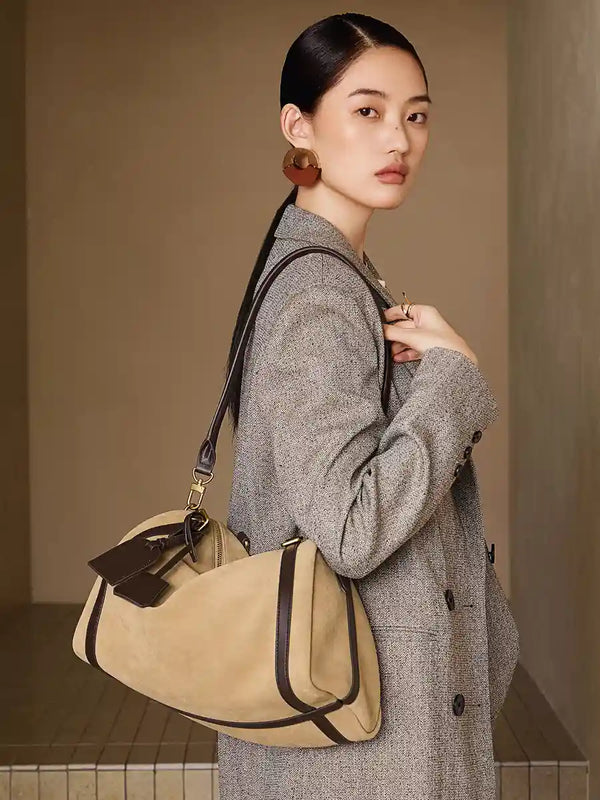 Elegant model showcasing the Suede Crescent Shoulder Bag, a stylish hobo bag with a vintage-inspired design and adjustable strap.