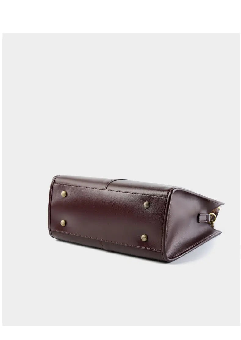 Top-Handle Leather Tote base view showcasing its elegant design and brass studs for stability.