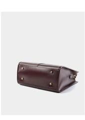 Top-Handle Leather Tote base view showcasing its elegant design and brass studs for stability.