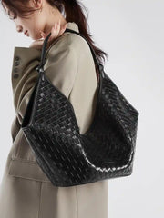 Large Woven Shoulder Bag in black, showcasing its refined texture and stylish design for everyday use.