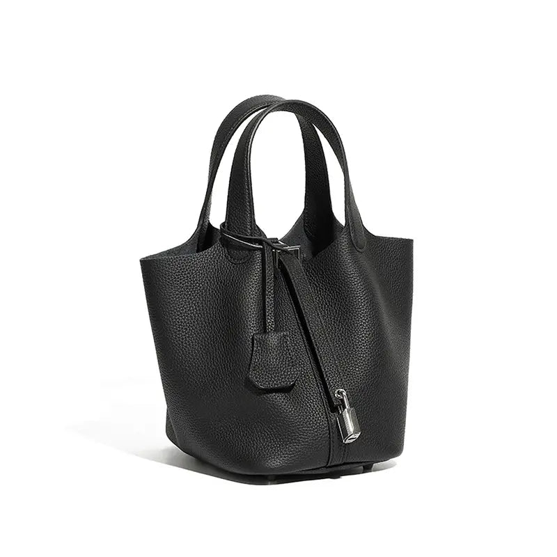 Classic Leather Bucket Bag in black with top-handle and minimalist design, showcasing a chic side view.