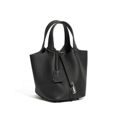 Classic Leather Bucket Bag in black with top-handle and minimalist design, showcasing a chic side view.