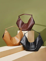 Large Woven Shoulder Bag in black, brown, and tan, showcasing a stylish woven design for everyday use.