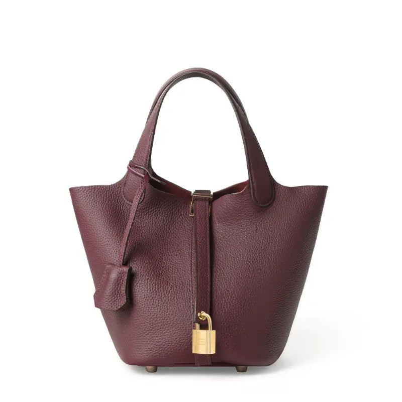 Classic Leather Bucket Bag in rich burgundy color showcasing top-handle and drawstring design.