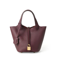 Classic Leather Bucket Bag in rich burgundy color showcasing top-handle and drawstring design.