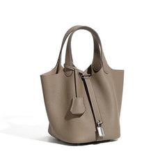 Classic Leather Bucket Bag in a chic neutral tone, featuring minimalist design and top-handle for everyday style.