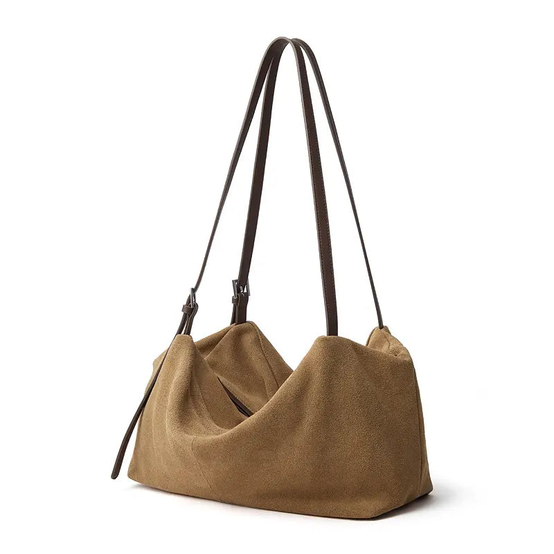 Suede Leather Pillow Hobo Bag showcasing a modern tote silhouette with dual shoulder straps and a chic suede texture.