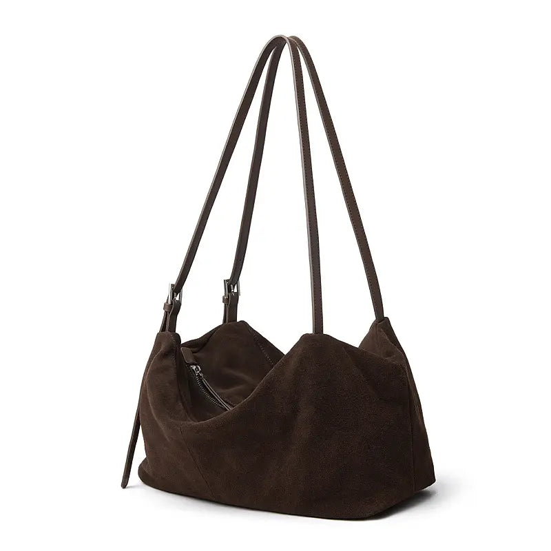 Suede Leather Pillow Hobo Bag featuring dual shoulder straps and a sleek silhouette for stylish everyday use.