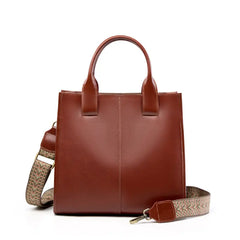 Top-Handle Leather Tote in brown leather with adjustable strap, perfect for everyday use and casual outings.