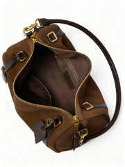 Suede Crescent Shoulder Bag interior view showing zipper, leather trims, and spacious design.