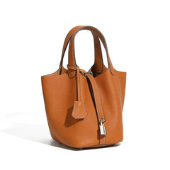 Classic Leather Bucket Bag in warm neutral tone, showcasing top-handle and drawstring design, perfect for everyday style.