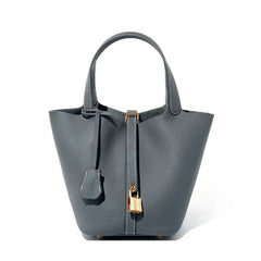 Classic Leather Bucket Bag in chic gray color, showcasing the minimalist design with top-handle and drawstring.